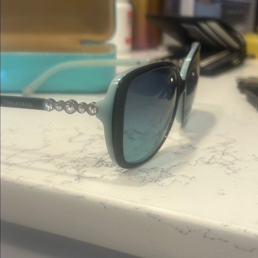 You pick glasses Tiffany & Co. Black and Blue Sunglasses